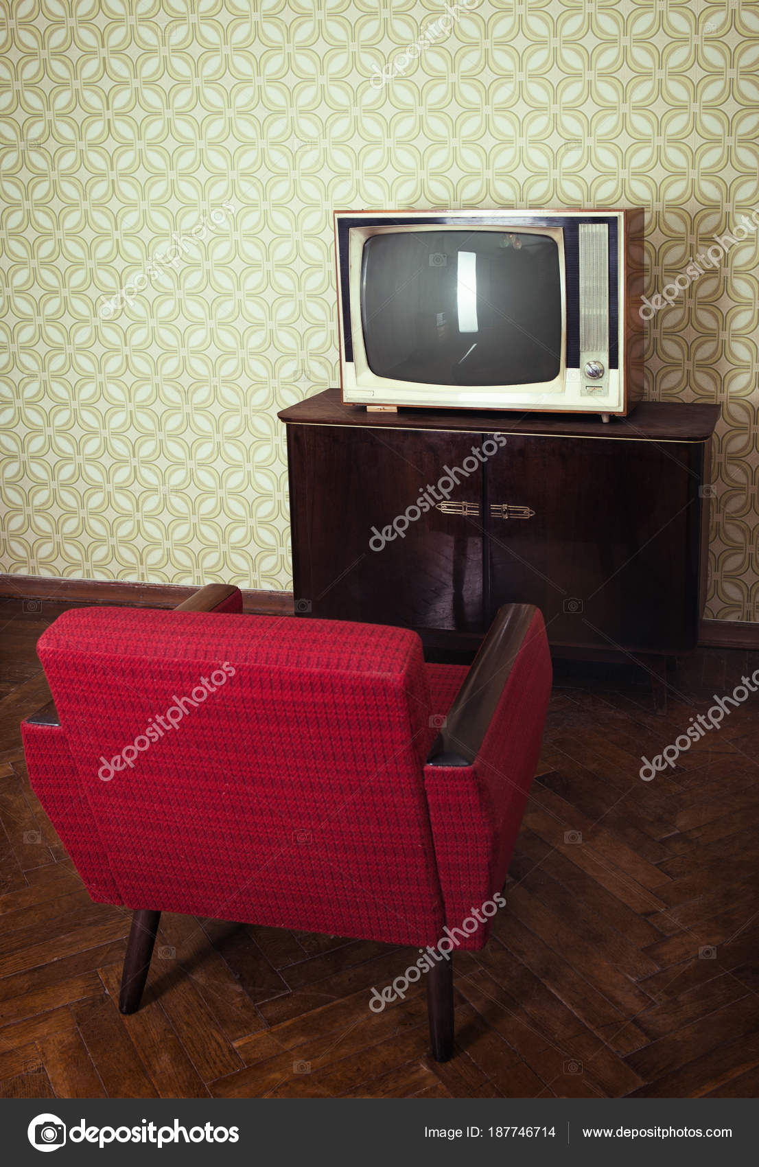 Vintage room with old fashioned red armchair and retro tv over o Stock