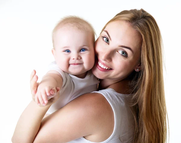 Jonge moeder met haar baby dochter blij brede glimlach, studio portra — Stockfoto