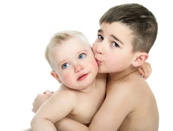 Adorable kids. Portrait of beautiful little boy embracing his cr — Stock Photo, Image