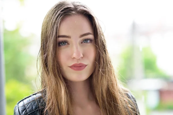 Young attractive woman standing in the rain directing her face t — Stock Photo, Image