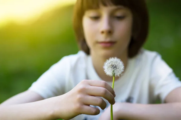 Boy with dandelion over blured green grass, summer nature outdoo — Stock Photo, Image