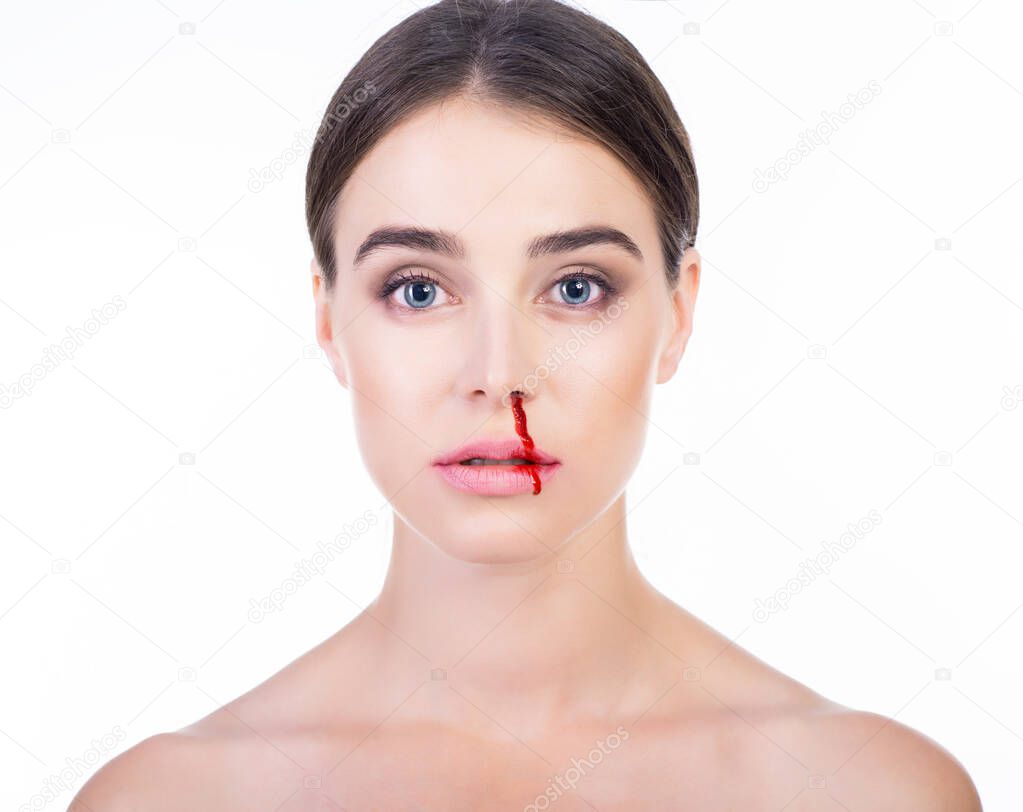 Young beautiful woman with bleeding nose. Anti-glamor. Beautiful woman blood on her face. Domestic violence, tyranny, despotism, women's rights, victim of house tyrant concept.