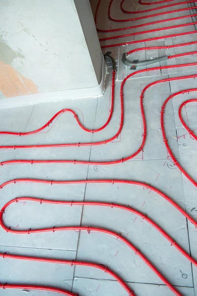 Heat floor instalation. Repair, engineering. Underfloor heating technology. Construction work, repair. Renovation