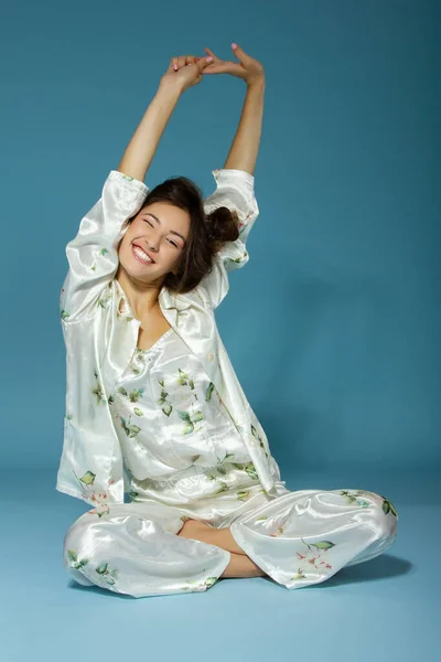 Attractive Cheerful Sleepy Teen Girl Wearing Pyjamas Isolated Blue Background — Stock Photo, Image