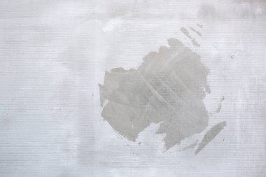 Eski gri beton duvarın desenli arka planı. Yüzey sıvama ve boyama için hazır. İnşa, inşa.