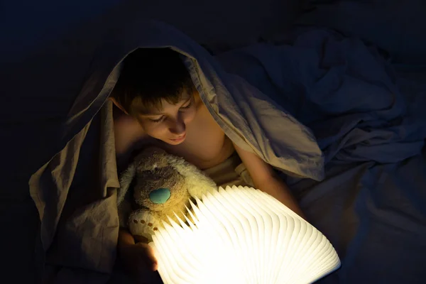 Adorable Boy Reads Book Sleeping Bed Home Happy Childhood — Stock Photo, Image