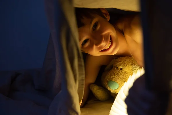 Adorable Boy Reads Book Sleeping Bed Home His Old Toy — Stock Photo, Image