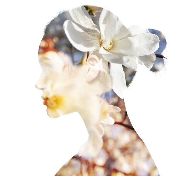 Double exposure portrait of beautiful girl in profile. Young woman with spring white flowers. Youth, nature, natural cosmetics, beauty treatment, spring season and healthy life concept.