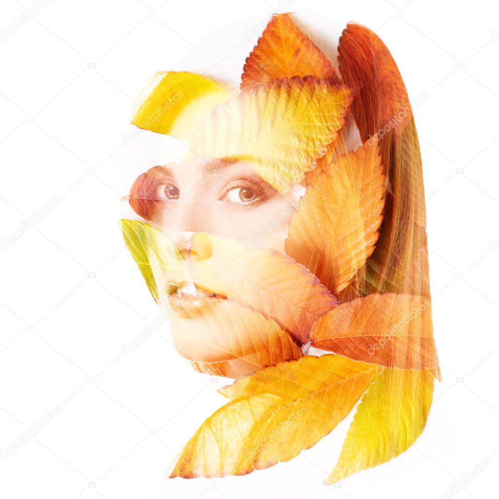 Double exposure portrait of beautiful young redheaded woman and fall leaves isolated on white background. Autumnal seasonal concept design element