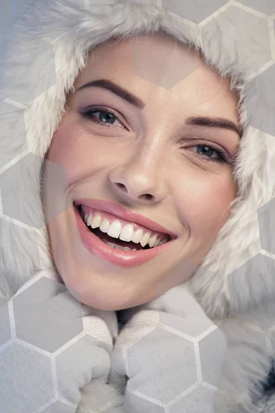 Happy woman wearing a fur cap — Stock Photo, Image