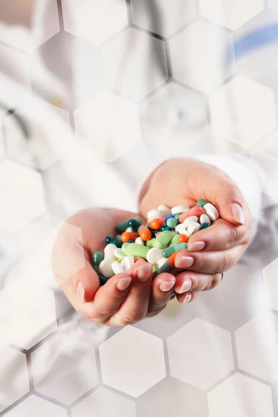 Doctor with pills in her hands — Stock Photo, Image