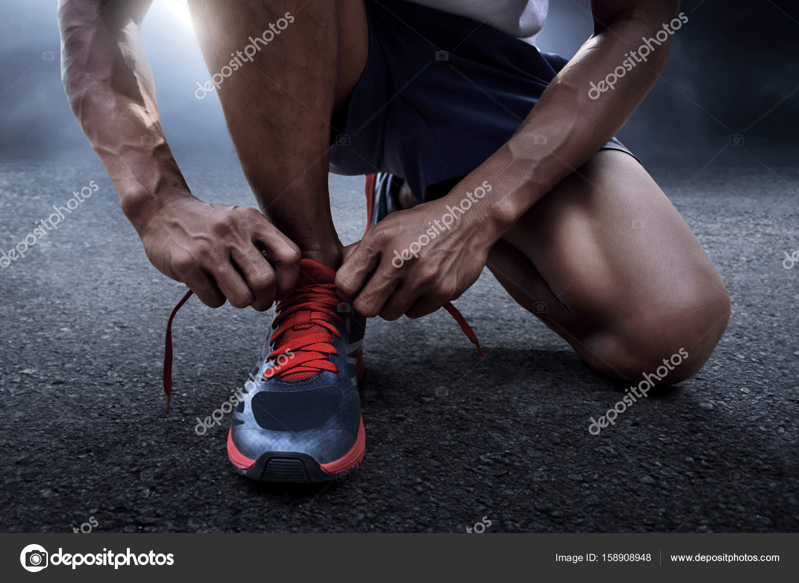 tying running shoes