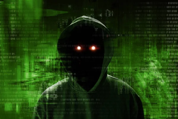 Unknown hacker standing over binary code — Stock Photo, Image