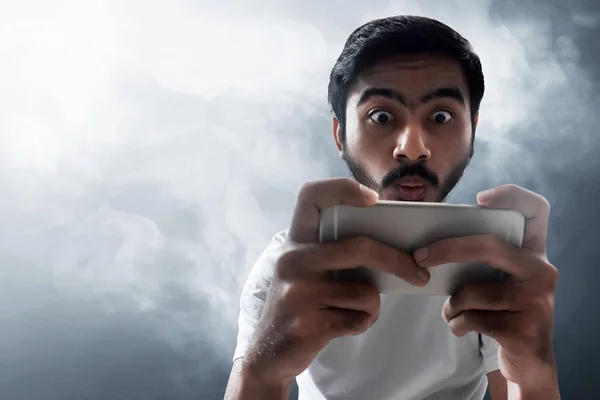 Man playing mobile game