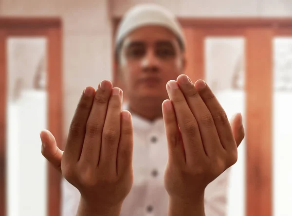 Religious muslim man praying