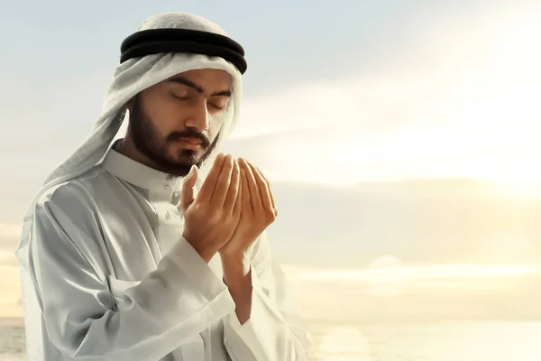 Religious arab muslim man praying