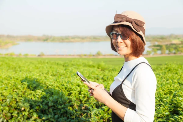 Asian woman using smart phone. — Stock Photo, Image