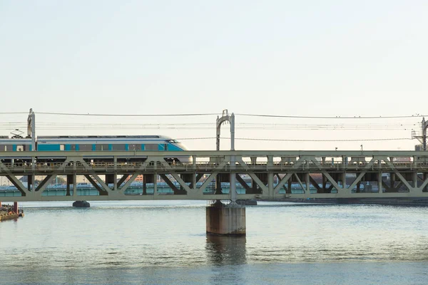Train on the bridge is crossing the river. — Stock Photo, Image