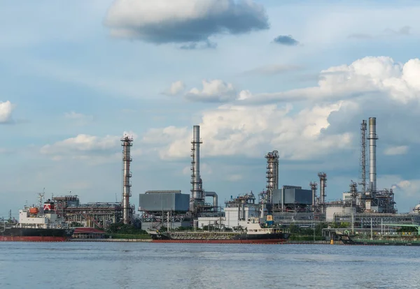 Petroleum Refining Plant. There are crude oil shipments from the river