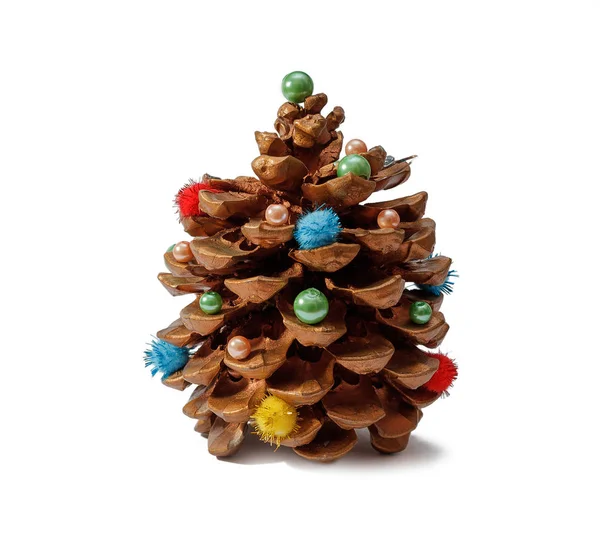 Pine cone with decorations — Stock Photo, Image