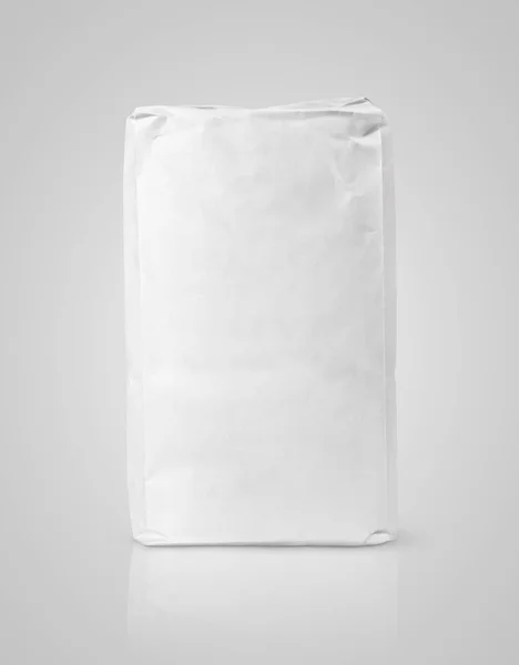 White blank paper bag package of flour on gray — Stock Photo, Image