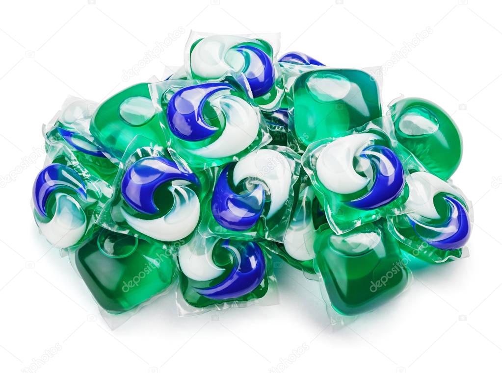 gel capsule pods with laundry detergent on white