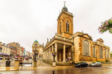 Northampton, UK - Aug 08, 2017: Cloudy rainy day view of All Saints Church in Northampton Town Centre clipart