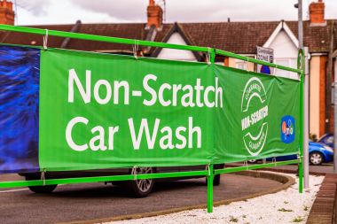 Northampton UK October 3, 2017: IMO Attended car wash logo sign in Northampton town centre clipart