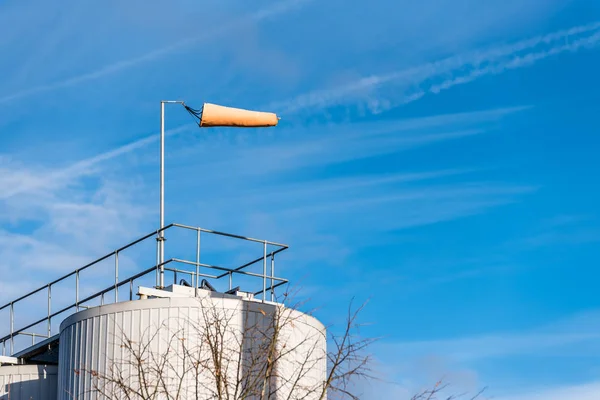 Air Wind Direction Indicator on Chemical Factory over Blue Sky - air sock, drogue, wind sleeve, wind cone