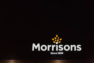 Northampton UK January 21 2018: Morrisons Superstore logo sign exterior at night clipart