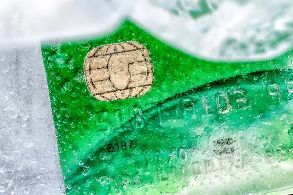 Closeup view ice frozen credit debit card — Stock Photo, Image