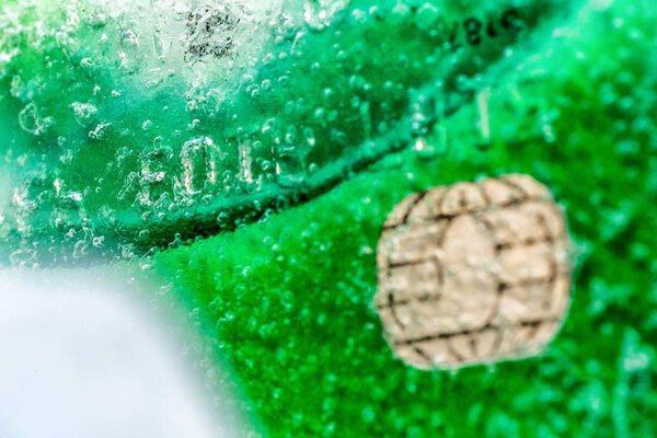 Closeup view ice frozen credit debit card