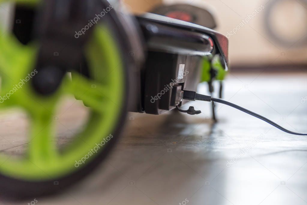 Closeup day view electric scooter charging up