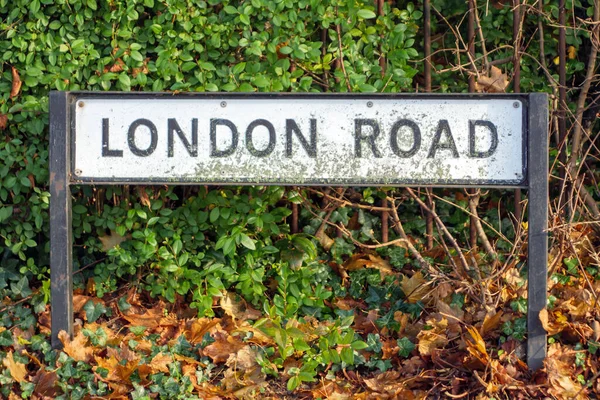 London road sign post in town in england uk — стоковое фото