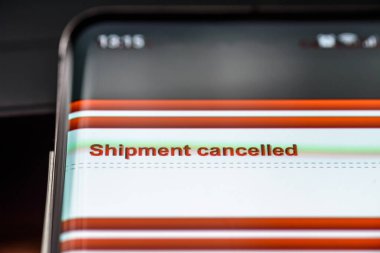 shipment cancelled text on smart phone screen. clipart