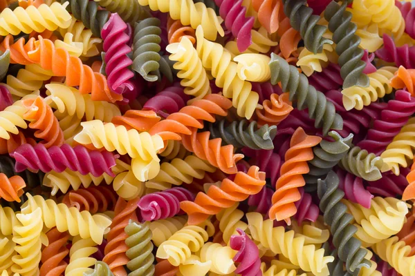 Primo piano di pasta cruda eco maccheroni fondo . — Foto Stock