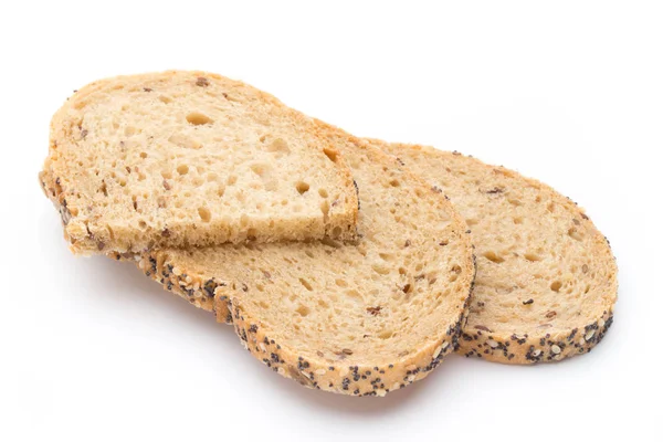 Wit brood, volkoren brood gesneden op een houten tafel. — Stockfoto