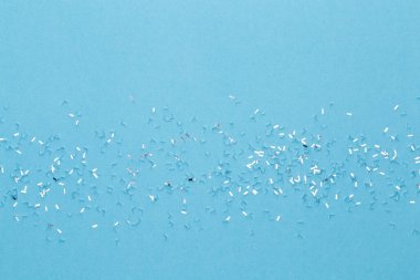 Şenlikli pastel arka plan. Noel yıldızları ve pastel arka planda parlayan parıltılar. Noel zamanı. Düğün için. Doğum günü. Sevgililer Günü. Düz yatıyordu.