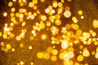 Bulanık altın bokeh afiş arka planında Mutlu Noeller.