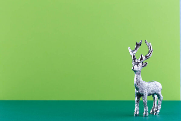 Christmas reindeer on pastel color background. Christmas or New Year minimal concept.