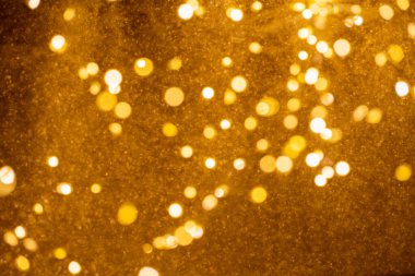 Bulanık altın bokeh afiş arka planında Mutlu Noeller.