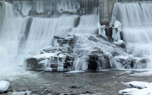 Frozen waterfall flow from an electrical barrage — Stock Photo, Image