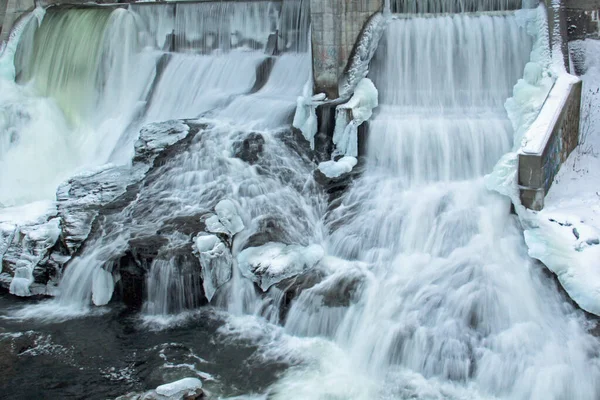 Frozen waterfall flow from an electrical barrage — Stock Photo, Image