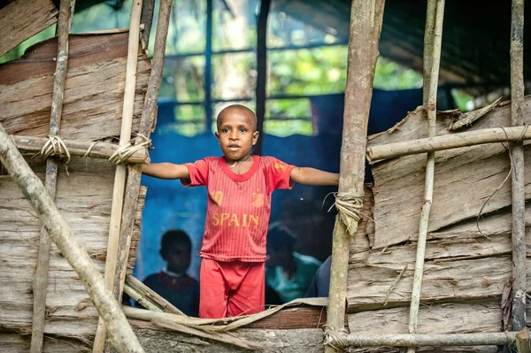 Papuan little boy in red clothing — Stock Photo, Image