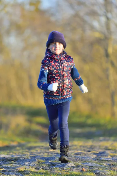 Happy little girl running — Stock Photo, Image