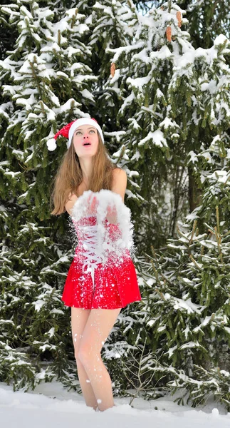 Santa-girl throws up snow — Stock Photo, Image