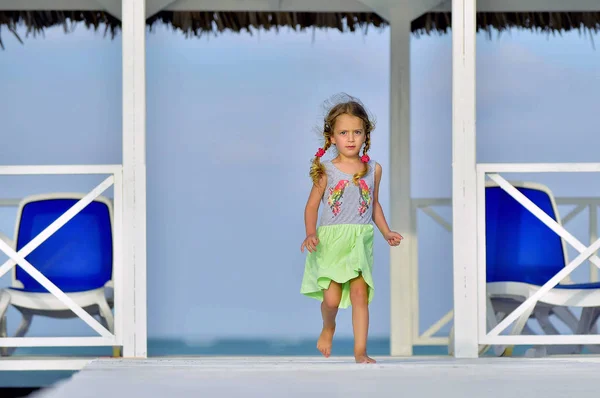 Little Girl Colorful Dress Jumping Dancing White Wooden Pier Ocean — Stock Photo, Image