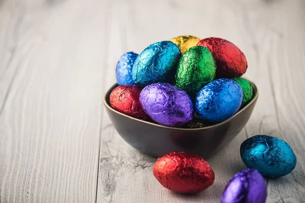 Colourful easter eggs in metallic wrapping — Stock Photo, Image
