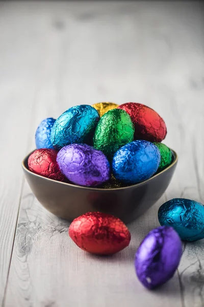Colourful easter eggs in metallic wrapping — Stock Photo, Image