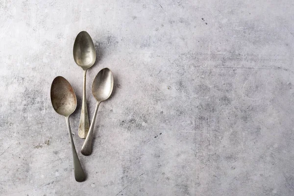 Three Spoons Grey Back Ground — Stock Photo, Image